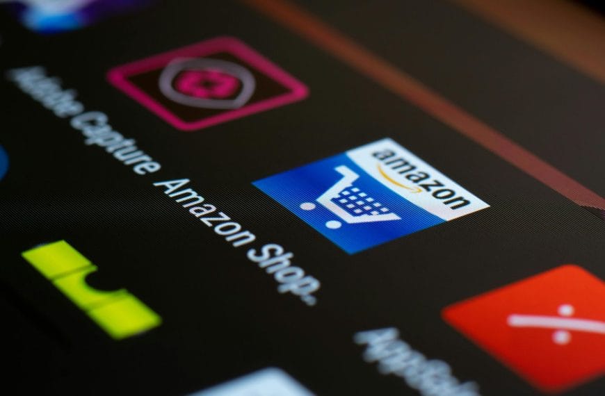 Smartphone screen displaying the Amazon Shopping application icon illustrating digital platform power.