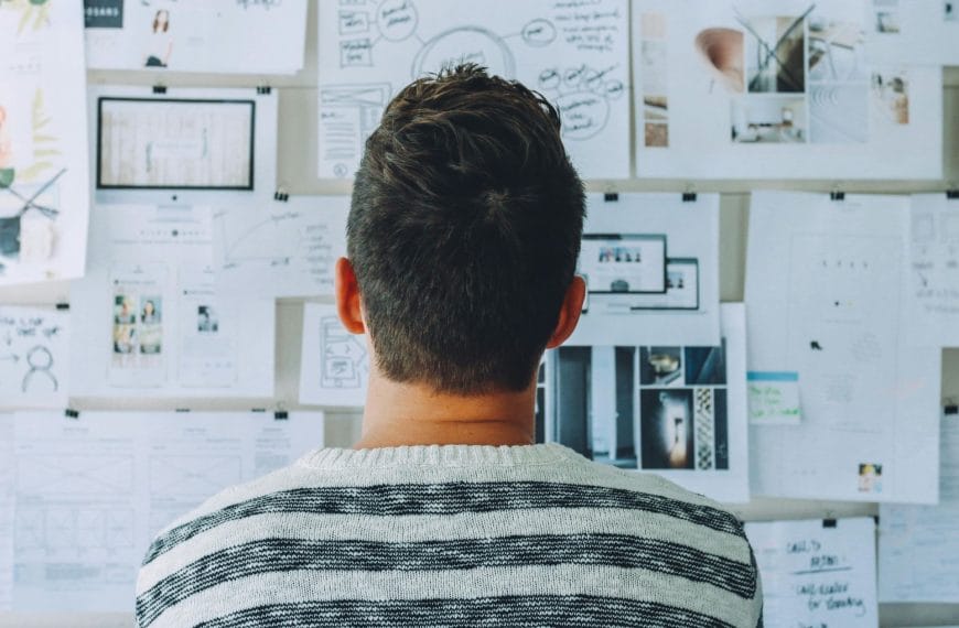 Professional analysing strategic planning boards to build robust supply chain resilience against global disruptions.